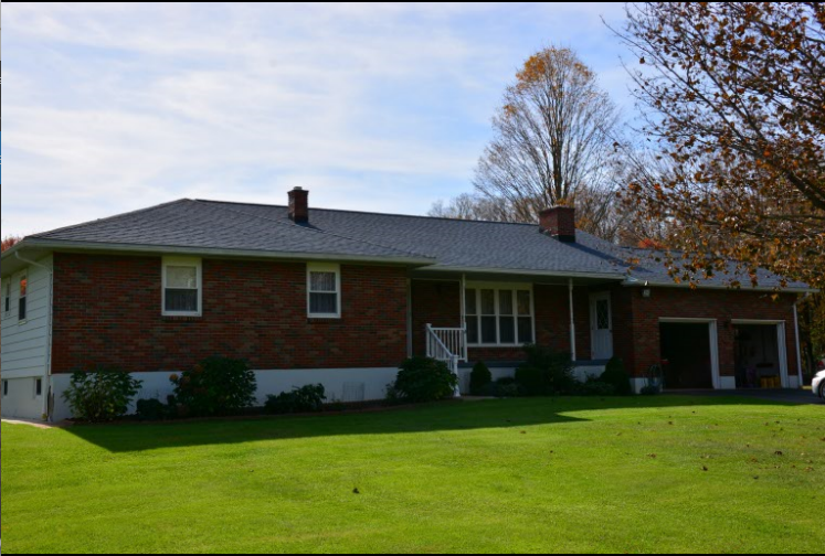 Replacement shingles matched and blended into an existing roof